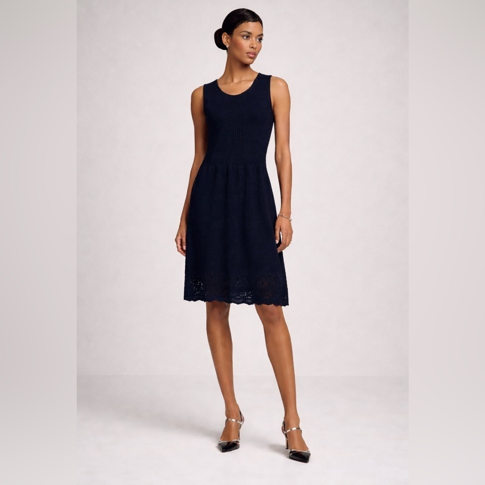 St. John sleeveless black with metallic thread knee length knit dress. Size 12.
